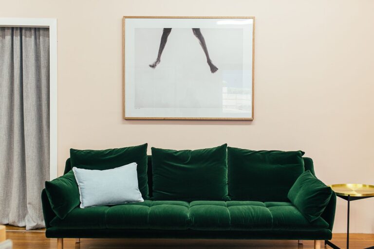 Green fabric sofa with cushions being sold second hand in Dubai